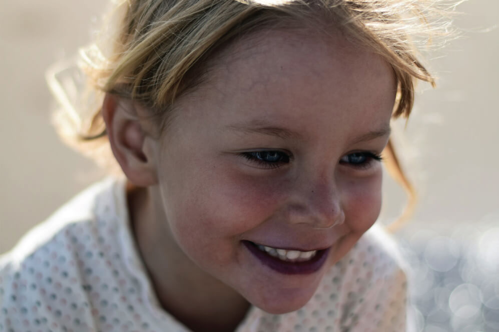 Young girl grinning